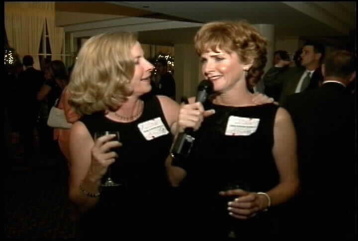 Two women in black dresses